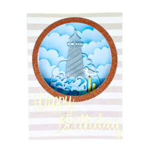 Carte anniversaire artisanale Coq'Ci effet hublot avec phare et vagues en relief.